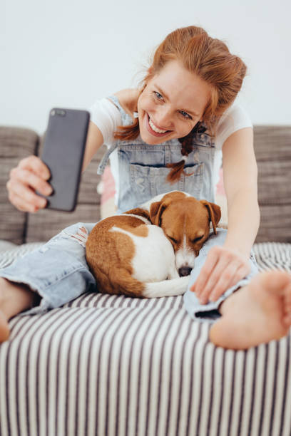 istock Cute happy young woman taking a selfie 1249145379