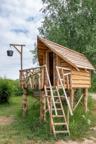 istock Wooden playhouse in a park 1249146089