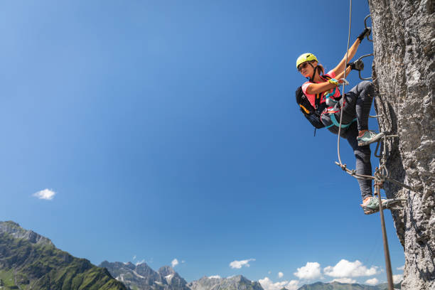 istock Pretty, female climber on a via ferrata 1249147260