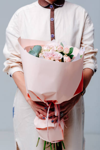 istock Bouquet of flowers in pink package 1249149723