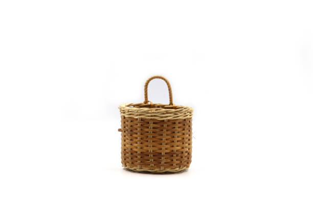 istock Wooden wicker basket isolated over white background. 1249153892