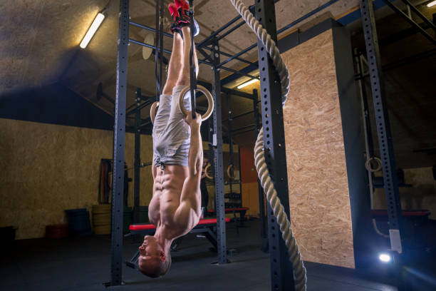istock Fitness dip ring man workout at gym dipping exercise 1249154899