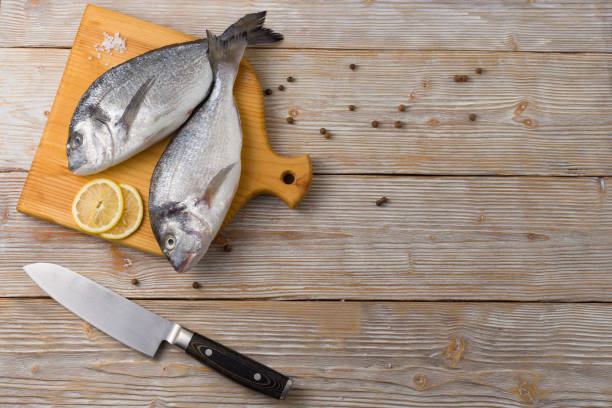 istock Fresh dorado on a cutting board top view flat lay, food background. 1249155375