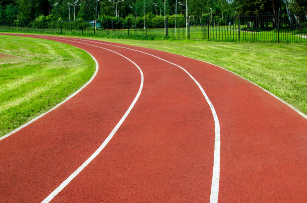 istock Red rubber running track in a stadium 1249156194