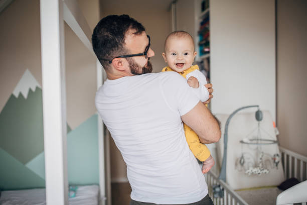 istock Father and baby son at home together 1249157004