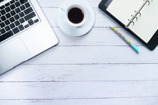 istock high angle view of laptop, tea and notepad on table 1249158329
