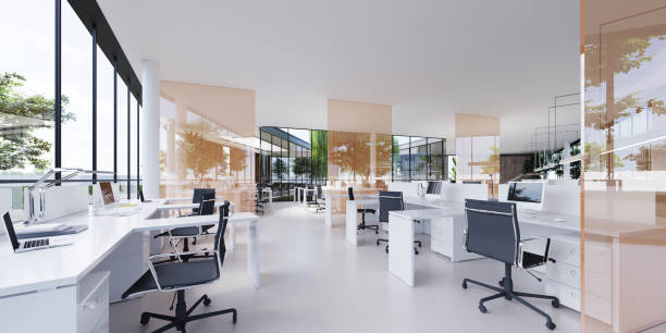 istock Spacious light and lighted office with work desks and glass partitions between. 1249162446