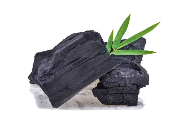 istock Natural wood charcoal isolated on white background 1249164902