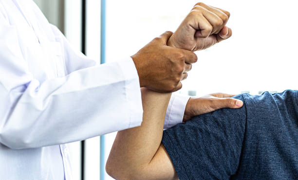 istock Midsection Of Doctor Examining Patient Hand 1249169956