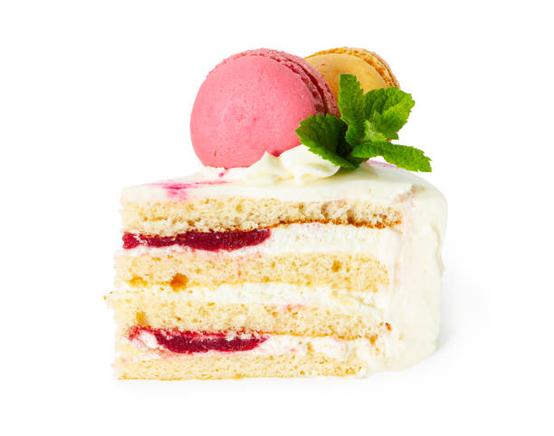 istock Piece of cake with mint and macaroon isolated on white 1249171117