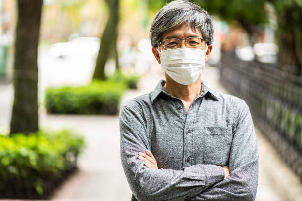 istock Mature Taiwanese businessman with protective face mask 1249171377
