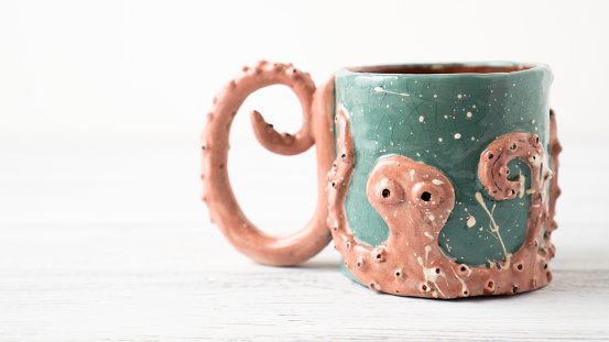 Self made Kraken mug. Clay cup. Original cup as a gift. Mug for children. Octopus crafts. Personalized mug. Coffee cup. High quality photo