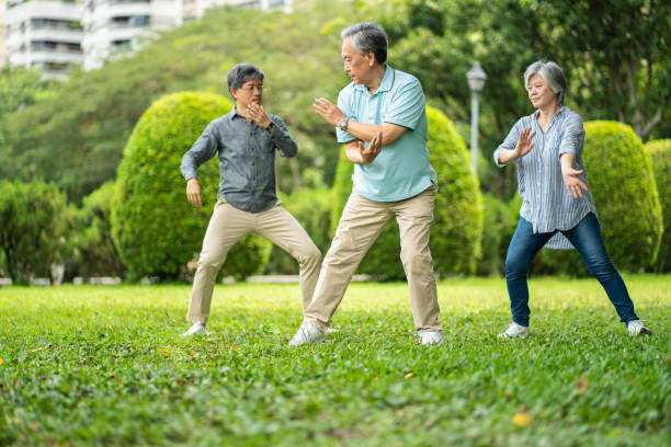 istock Senior friends practicing Tai Chi at public park 1249172145