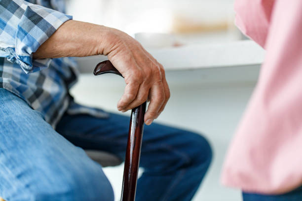istock Close up of a senior man with walking cane. 1249173664