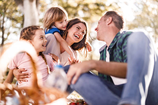 istock Cheerful family having fun on a picnic in spring day. 1249174494