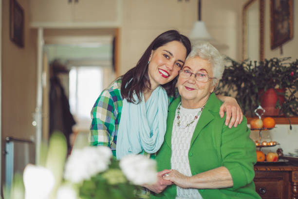 istock Social worker is visiting a senior woman 1249174854