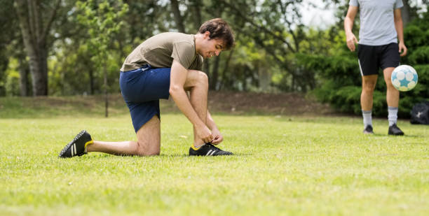 istock Fastening his shoelaces during the game 1249175935