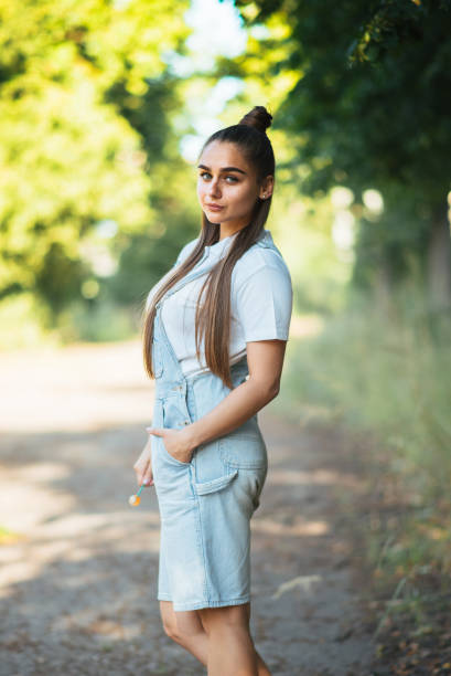 istock Girl with a silly facial expression, in nature. 1249176072