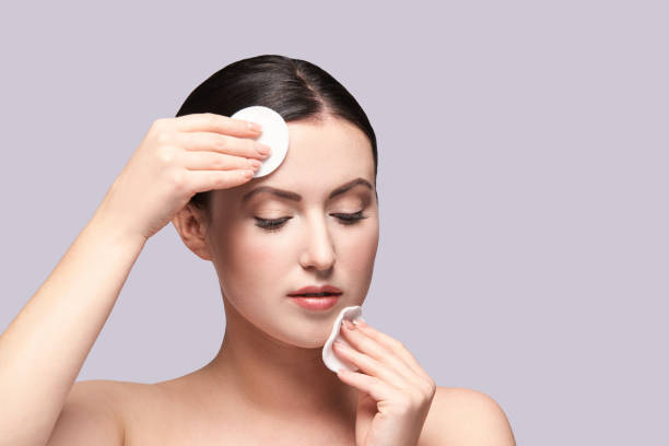 istock Girl remove mascara. Cotton pad. Skin care evening routine 1249177459