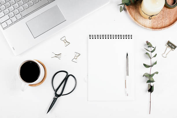 istock Flat lay with workplace with laptop, notebook, cup of coffee, eucalyptus, pen and scissors, candle. Top view, mockup, copy space. Planning, blog, blogger, freelancer concept 1249180199