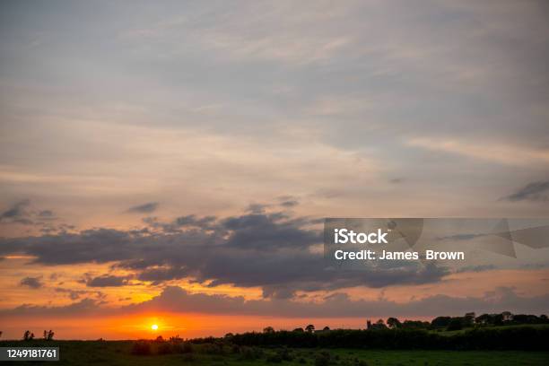 Sunset Over The Hamlet Of Billy Near Bushmills Stock Photo - Download Image Now - Agricultural Field, Beauty In Nature, Black Color
