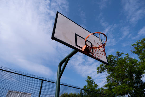 istock Basketball rim in sunny day 1249183178