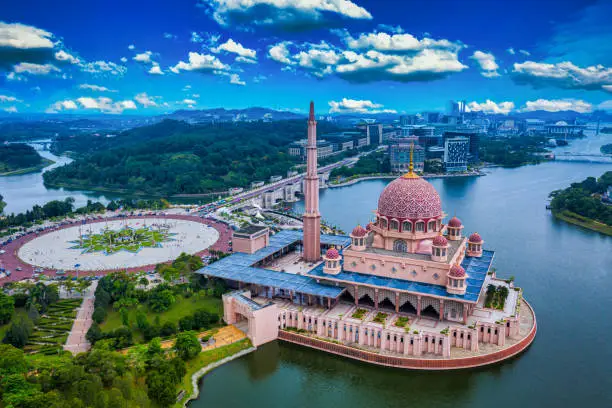 Photo of Aerial View Of Putra Mosque with Putrajaya City Centre with Lake at sunset in Putrajaya, Malaysia.