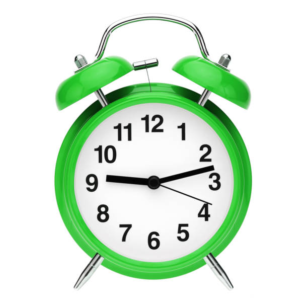 istock Green retro alarm clock isolated on white background 1249185470