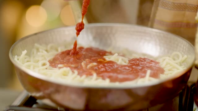 Slow Motion Tracking Shot Of Macaroni with Tomato Sauce in 4K Resolution
