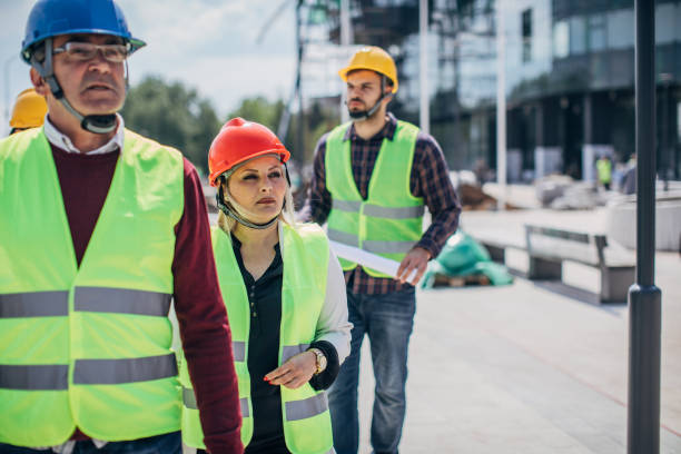 istock Engineers and architects walking at the construction site outdoors 1249188233
