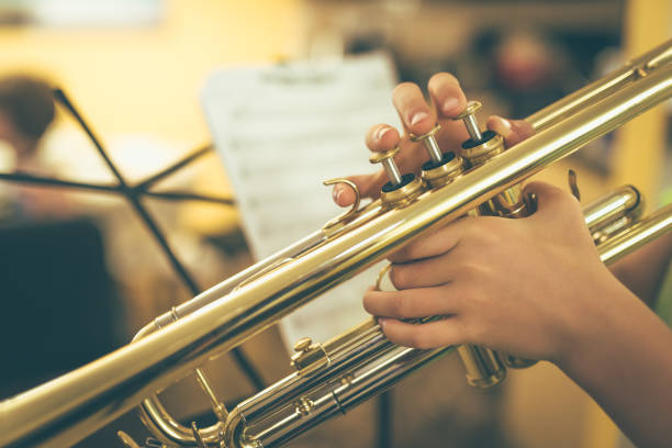 Child  playing a trumpet