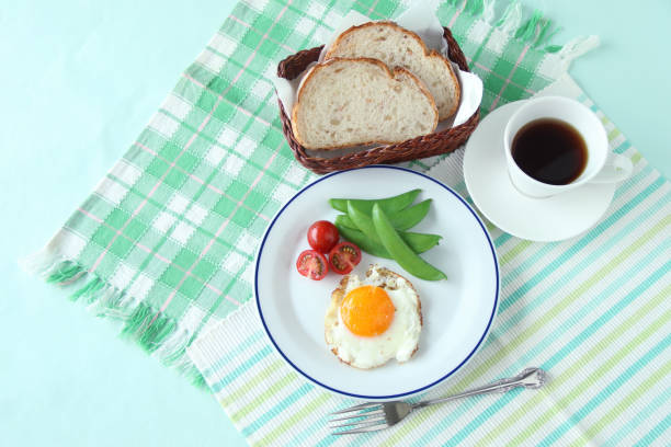 fried eggs - breakfast images fried eggs - breakfast images egg cherry tomato rye stock pictures, royalty-free photos & images