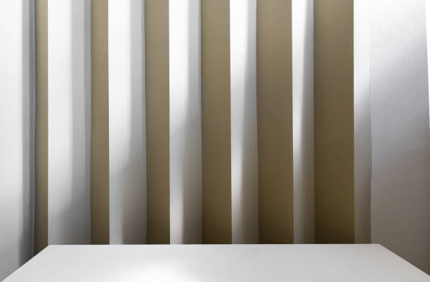 istock Studio table top with corrugated wall with yellow color paint in minimal style interior/ copy space / empty scene 1249191288