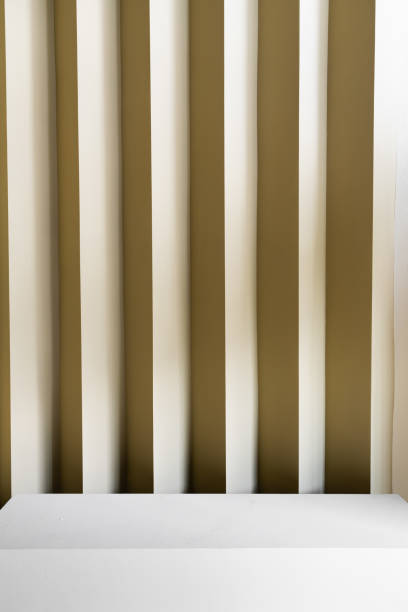 istock Studio table top with corrugated wall with yellow color paint in minimal style interior/ copy space / empty scene 1249191289
