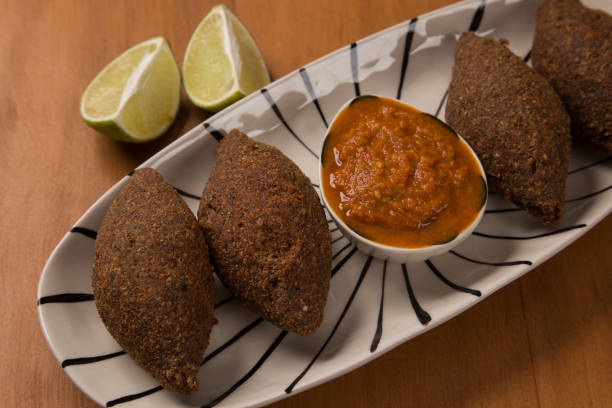 istock fried kibbeh served with pepper sauce, on a white plate. 1249193530