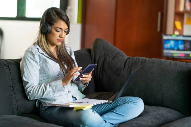 istock Young Woman Performs Her Homework From College From The Sofa At Home 1249195214
