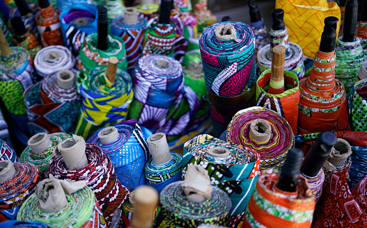 Otavalo, Ecuador - August 4, 2012: Ecuadorian Indian ethnic women in national clothes sells the products of his weaving, as usual on weekdays on a market in the Otavalo