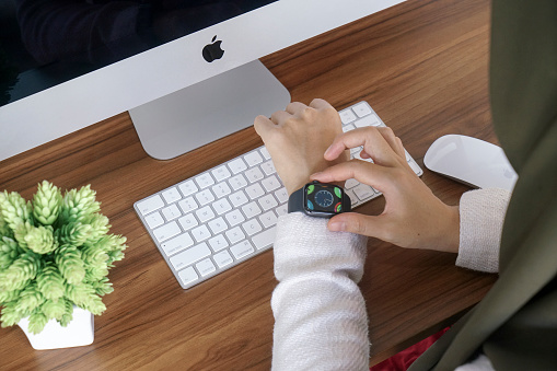 Bali Indonesia June 12, 2020 : female hands using with apple, Apple Watch is a line of smartwatches designed, developed, and marketed by Apple Inc.