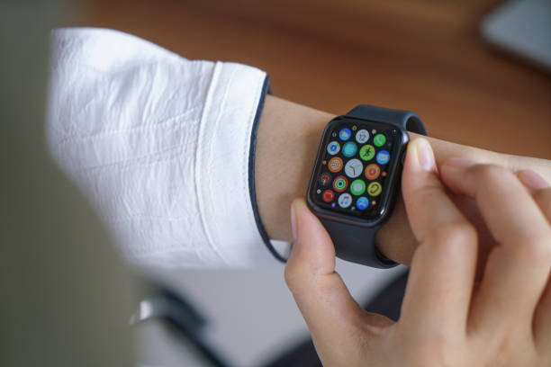 Apple Watch Bali Indonesia June 12, 2020 : female hands using with apple, Apple Watch is a line of smartwatches designed, developed, and marketed by Apple Inc. smart watch business stock pictures, royalty-free photos & images