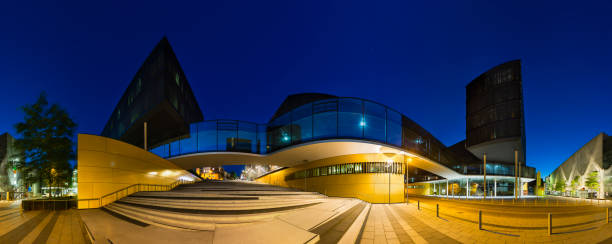 istock Modern Office Buildings At Night Panorama 1249199095