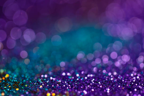 istock Festive twinkle lights background, abstract sparkle backdrop with circles,modern design wallpaper with sparkling glimmers. Blue, purple and green backdrop glittering sparks with glow effect. 1249200605