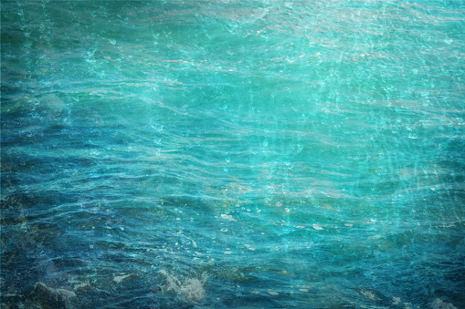 Nature element Water, abstract background texture in blue and turquoise, for themes like sea, ocean, environmental protection and climate, copy space