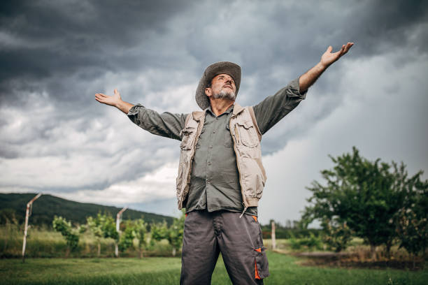 istock One senior man standing in the field and expecting rain 1249200692