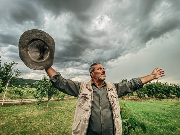 istock One man standing in the field and expecting rain 1249200747