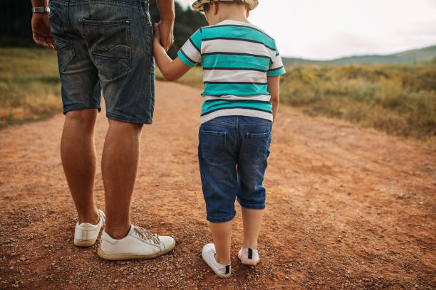 istock Father and son spending time in nature 1249202107