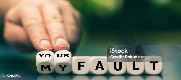 Hand Turns Dice And Changes The Expression My Fault To Your Fault Stock Photo - Download Image Now