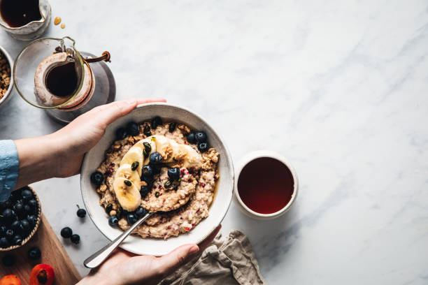 istock Woman serving healthy breakfast 1249205515