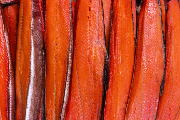 close up view of lot fillet salted cold smoked red fish king salmon. prepared and ready-to-eat pacific fish chinook salmon - asian delicacy cuisine - alaskan salmon imagens e fotografias de stock