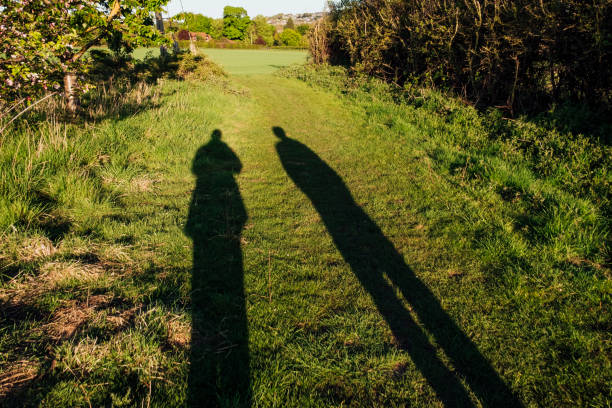 ロックダウンで散歩する - silhouette sunrise non urban scene england ストックフォトと画像