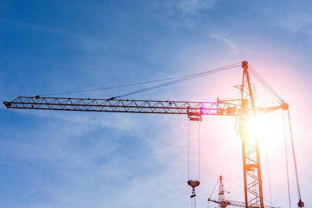 istock crane and scaffolding in the construction site. Construction high-rise building concepts. 1249208086